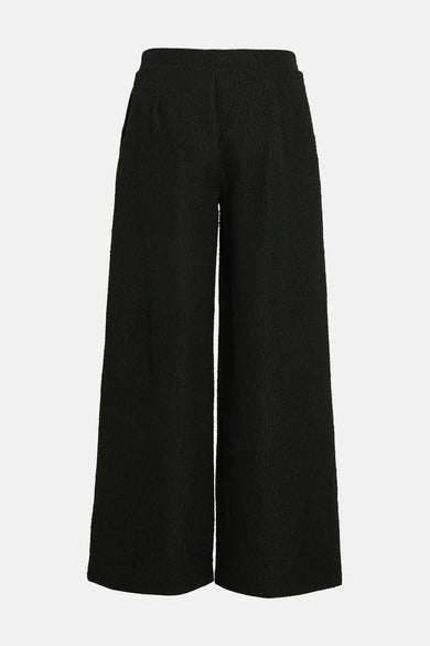 Pantalon noir de VILA®, ample et texturé, avec une coupe palazzo confortable.
