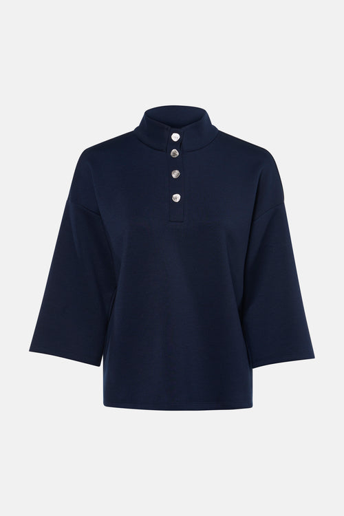 Sweat bleu de VILA®, à col montant avec patte de boutonnage argentée, et manches trois-quarts amples.
