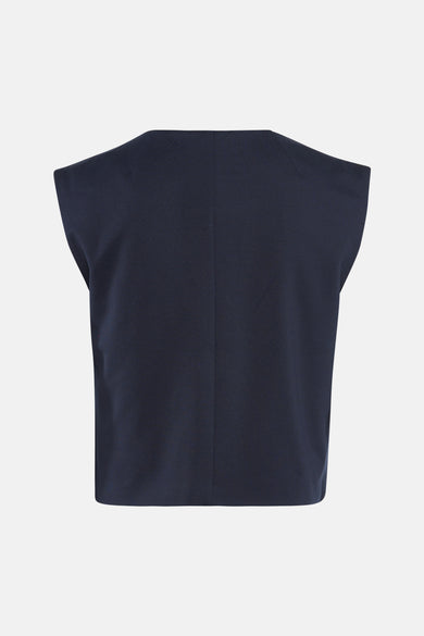 Blazer bleu de VILA, coupe carrée avec des épaules structurées, vue de dos sur fond clair.