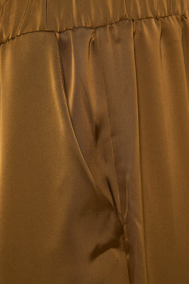 Pantalon doré de VILA, avec une texture satinée, une taille élastique et une poche latérale.