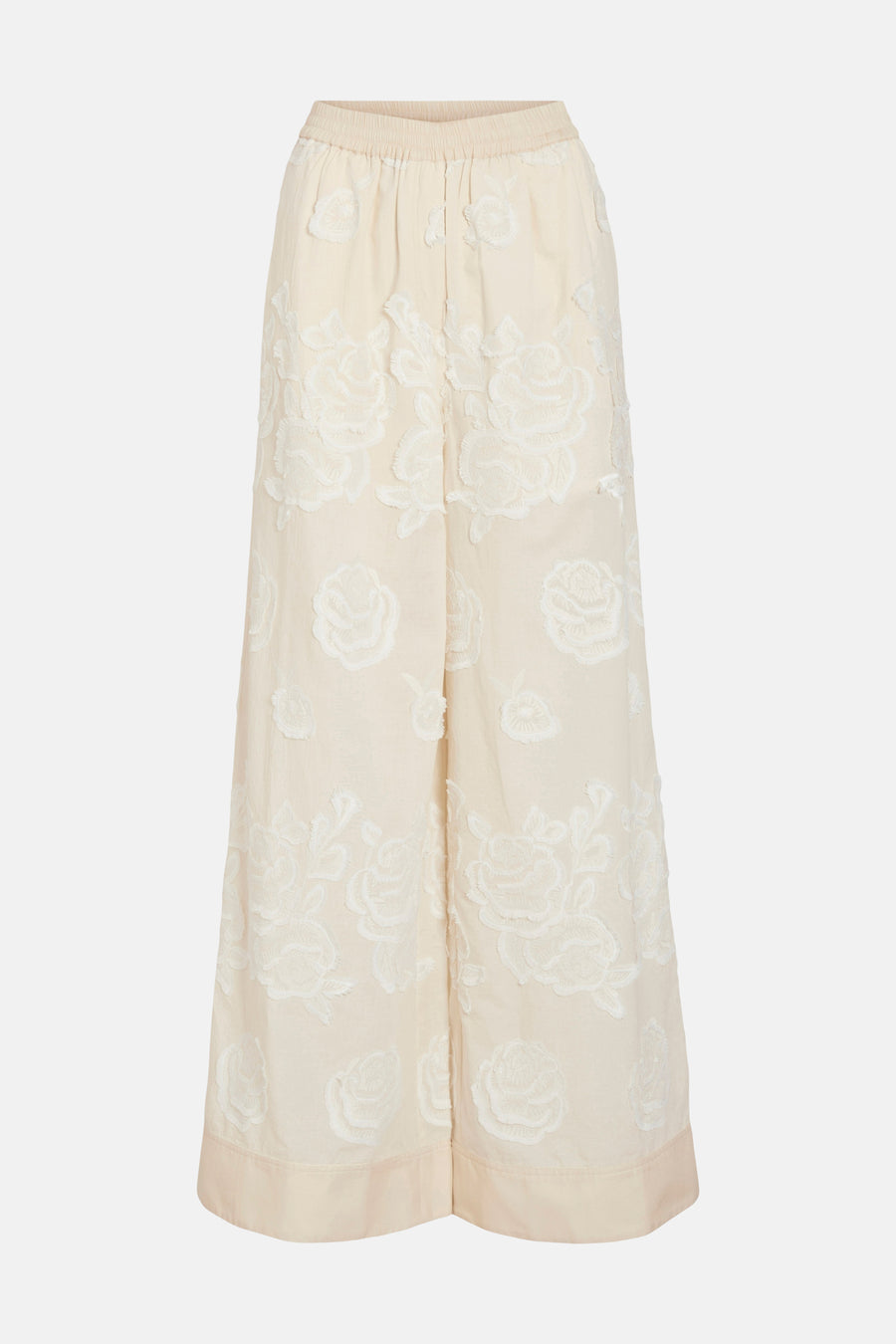 Pantalon beige de ROUGE EDIT avec broderies florales blanches, coupe large et taille élastiquée.