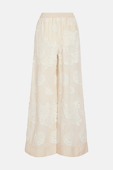 Pantalon large beige de ROUGE EDIT avec broderies florales blanches et taille élastiquée.