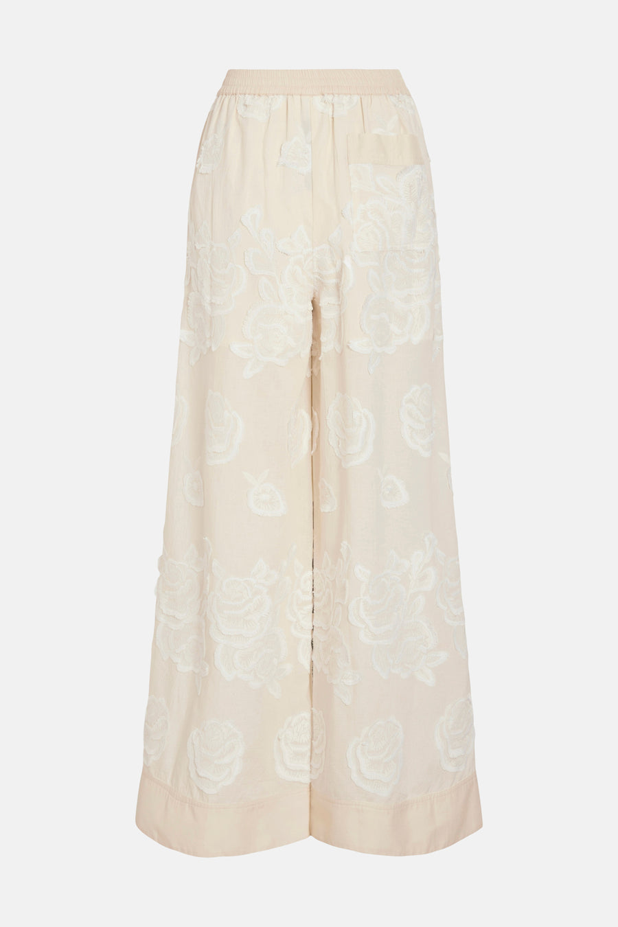 Pantalon large beige de ROUGE EDIT avec broderies florales blanches et taille élastiquée.