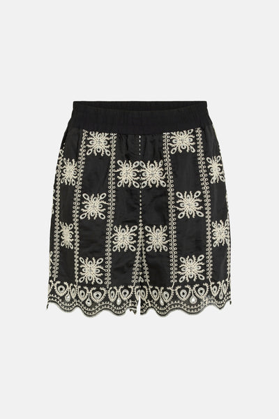 Black embroidered shorts with white floral patterns and scalloped hem, front view