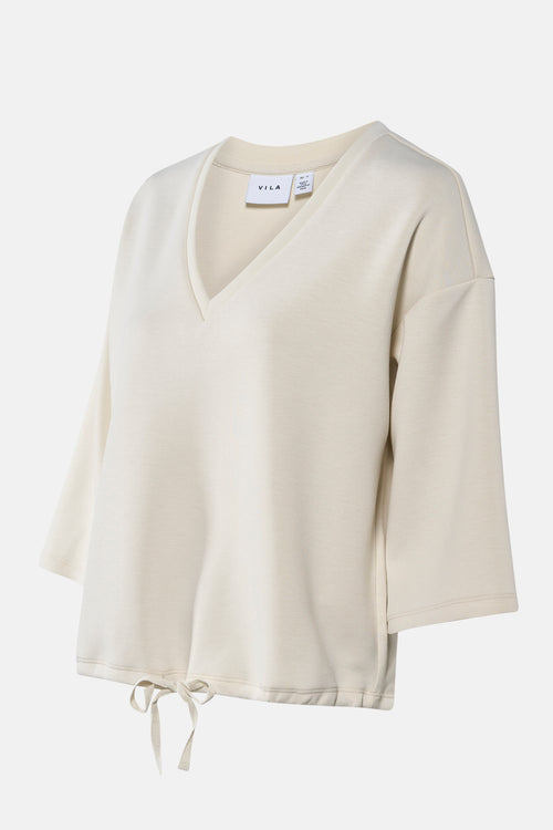 Sweat beige uni de VILA, avec cordon de serrage à la taille et col en V.