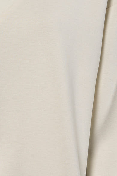 Sweat-shirt beige de VILA®, montrant une texture lisse et un drapé subtil.