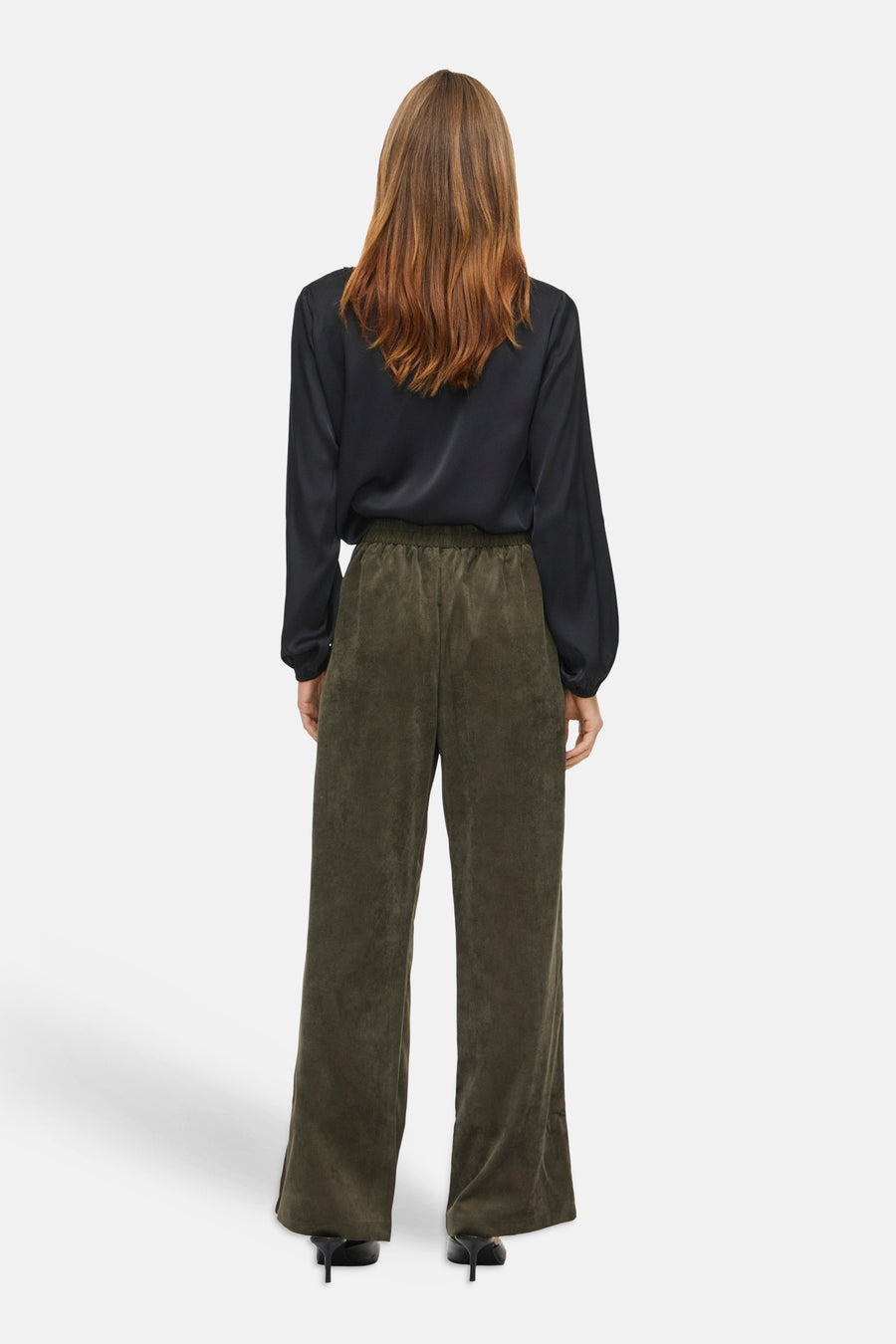 Olive green wide-leg corduroy pants by VILA, back view, with elastic waistband, paired with black blouse and heels