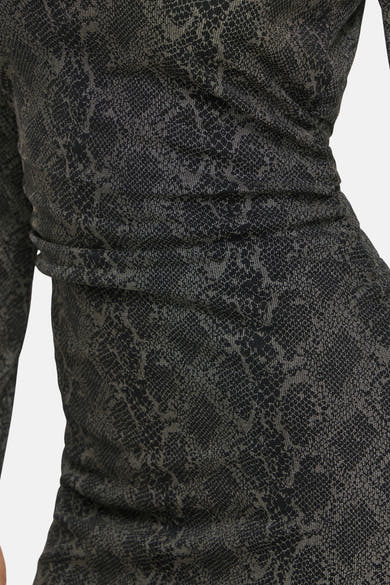 Black long-sleeve dress with snakeskin pattern and ruched waist, side view close-up