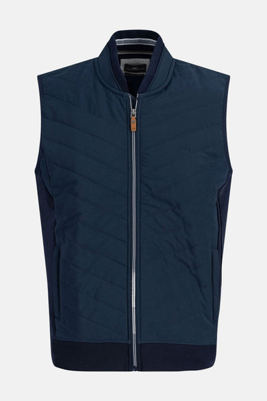 Gilet bleu de FYNCH-HATTON avec motif matelassé à chevrons et fermeture éclair argentée.
