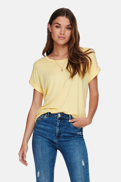 Pale yellow short-sleeve t-shirt with relaxed fit and rounded neckline, worn with distressed blue jeans and gold necklace, front view.