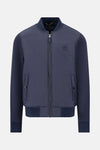 Veste bleue de FYNCH-HATTON avec manches en tricot, fermeture éclair et poches boutonnées.