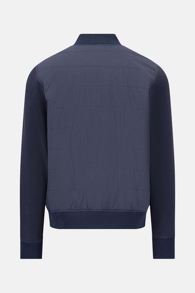 Veste bleue de FYNCH-HATTON avec corps matelassé et manches en tricot, vue de dos.