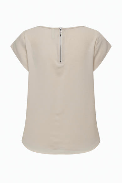 Blouse beige à manches courtes de ONLY®, avec fermeture éclair verticale au dos et texture subtile.