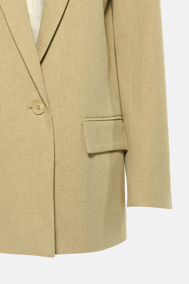 Blazer vert de GOA GOA en tissu texturé, avec col à revers, bouton unique et poche à rabat.