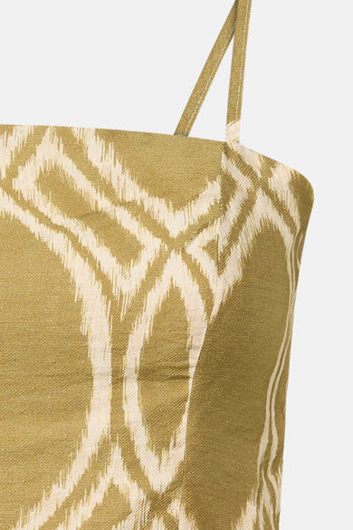 Groen GOA GOA top met ikat-patroon, spaghettibandjes, geweven textuurdetail.
