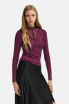 Deep purple long-sleeve ribbed top with lace V-neck and cuffs, worn with black skirt, front view