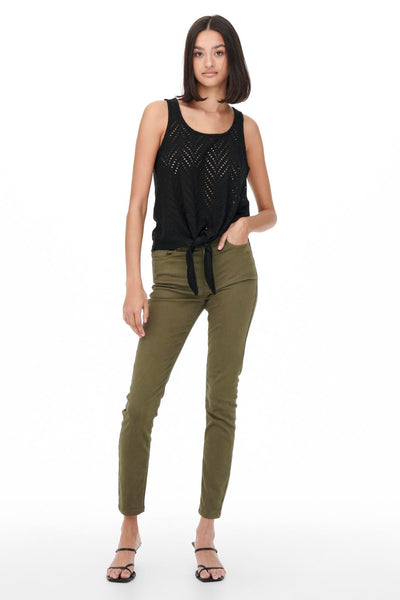 Black sleeveless top with eyelet pattern and front tie detail, worn with olive green pants and black sandals, full-length front view.