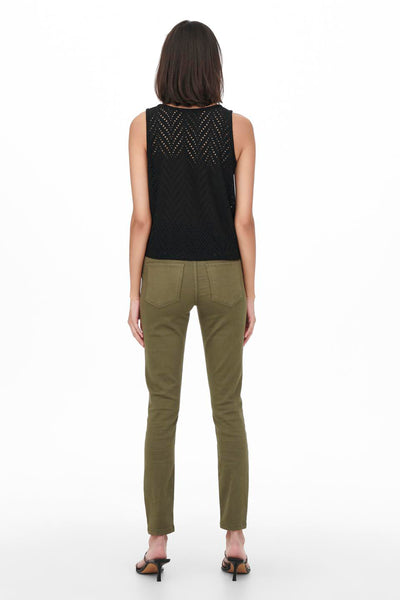 Black sleeveless top with perforated geometric pattern, back view, worn with olive green pants and black heels