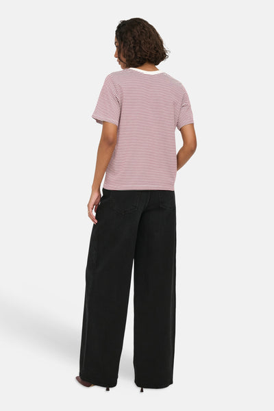 Red and white striped short-sleeve t-shirt from Cloud Dancer, back view on model wearing black wide-leg pants.