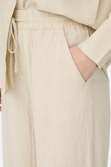 Pantalon beige de JDY en lin texturé avec taille élastiquée, cordon de serrage et poches latérales.