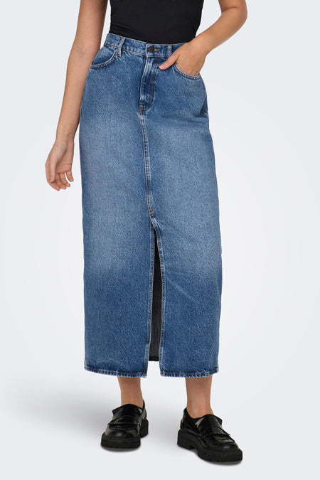 Blue denim long skirt with front slit and classic five-pocket design, worn with black top and chunky loafers, front view