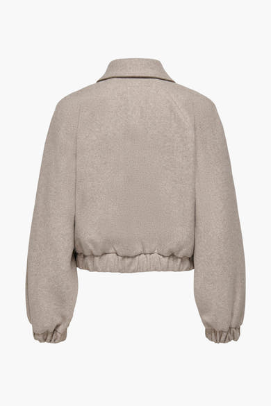 Veste courte beige de ONLY, avec des manches ballon, un col classique et une taille élastique.