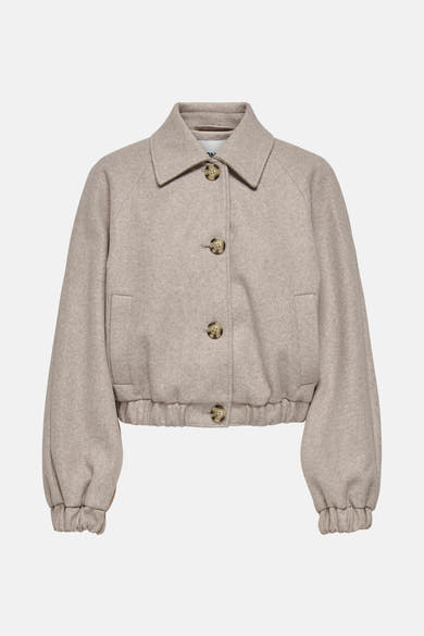 Veste courte beige de ONLY, avec fermeture boutonnée et manches ballon resserrées.