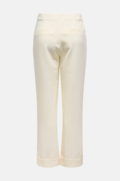 Ecru broek van ONLY, met paspelzakken achter en wijde zomen.