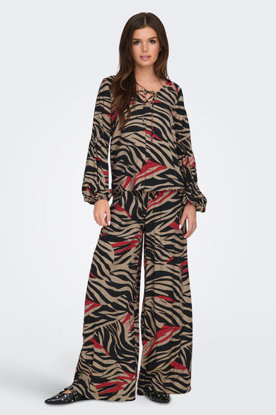 Pantalon coloré multicolore de JDY avec imprimé zèbre et coupe ample.
