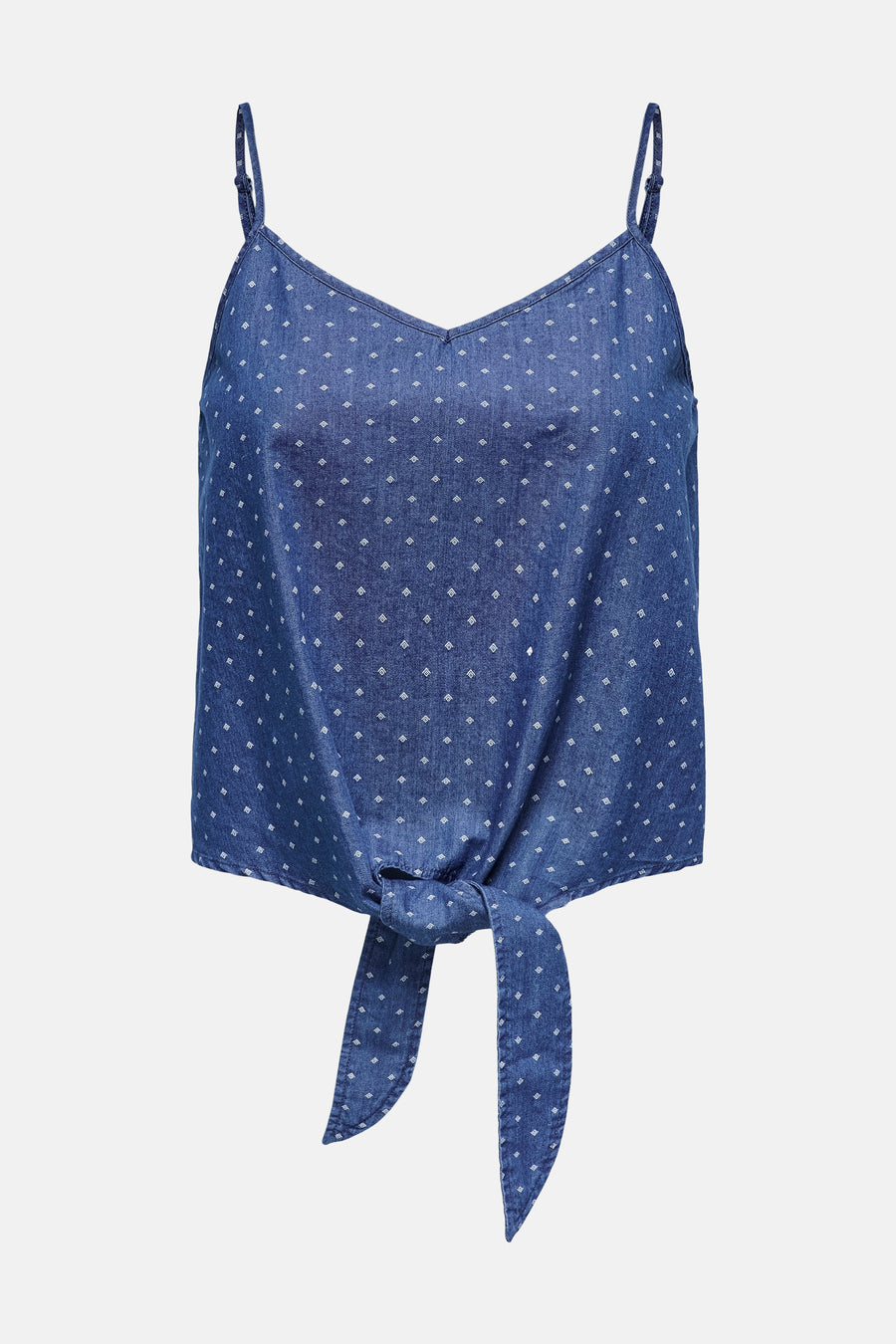 Chemisier sans manches bleu denim de ONLY, avec motif à pois blancs et nœud décoratif sur le devant.

