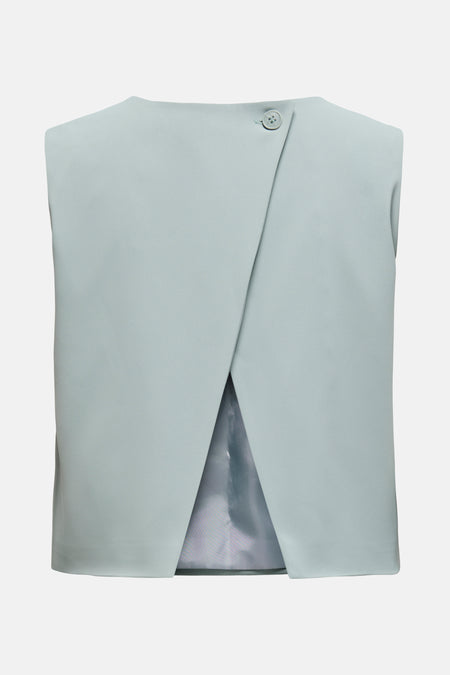 Blouse bleue sans manches de ONLY, avec une fermeture asymétrique à bouton unique.
