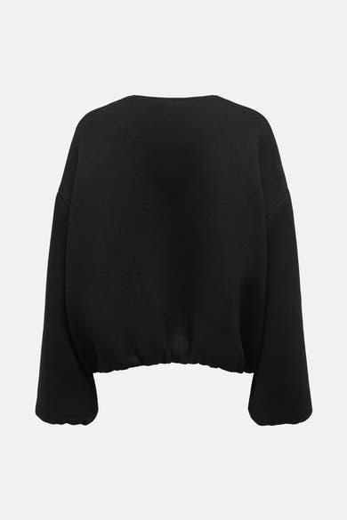 Kort zwart jasje van ONLY, met wijde mouwen en elastische zoom, achterzijde.