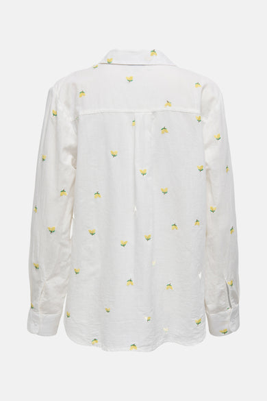 Chemise à manches longues blanche de JDY, avec motif brodé citron sur l'ensemble.