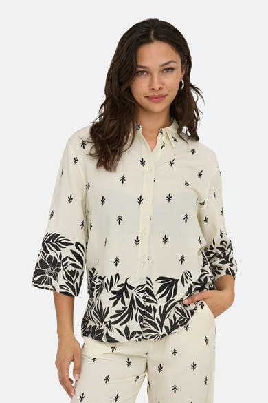 Ecru blouse met lange mouwen van JDY, bedrukt met zwart plantenpatroon en knopen.