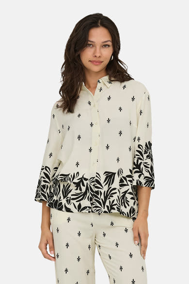 Ecru blouse met lange mouwen van JDY met een zwarte bloemenprint aan de onderkant.