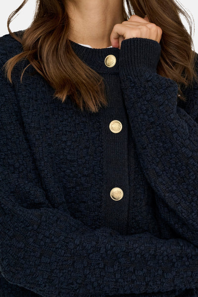 Cardigan bleu texturé de JDY, avec boutons dorés et manches longues.