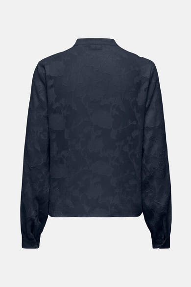 Chemise à manches longues bleue texturée de JDY, avec motif floral subtil et manches longues bouffantes.
