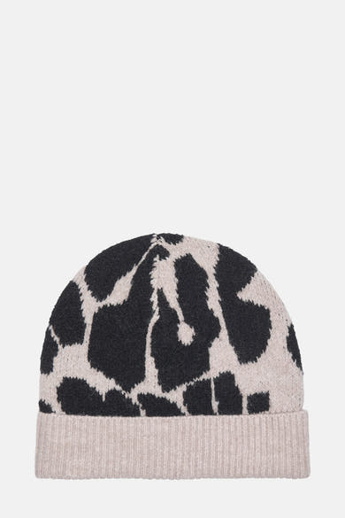Bonnet multicolore de JDY avec un motif tacheté noir et beige sur une maille douce.
