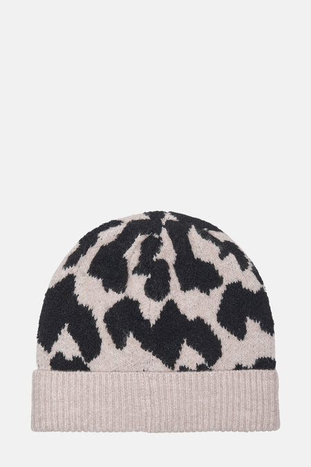Bonnet multicolore de JDY, avec un motif tacheté noir et beige sur une texture tricotée.
