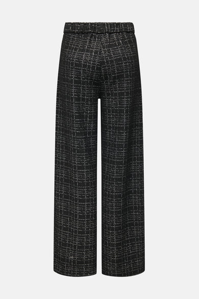 Pantalon noir de JDY, à carreaux avec une taille élastique, coupe ample sur un fond neutre.