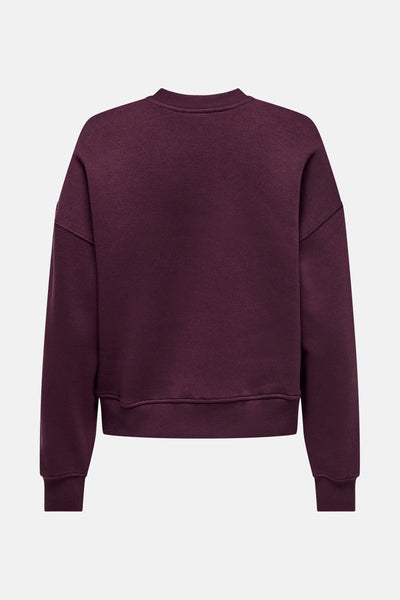Sweat rouge de ONLY, coupe décontractée avec encolure ras du cou et finitions côtelées.
