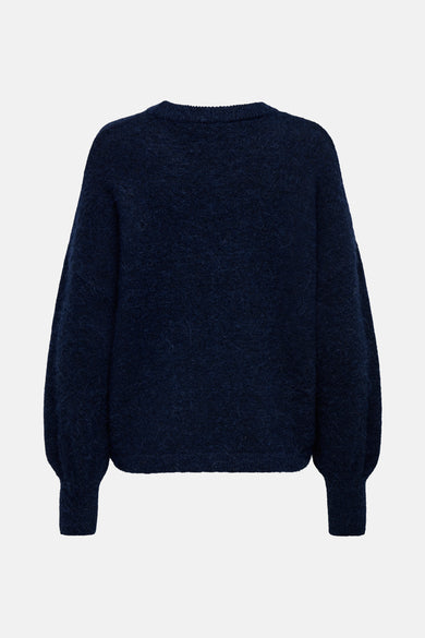 Pull à col rond bleu foncé de ONLY®, avec une texture duveteuse et des manches bouffantes.