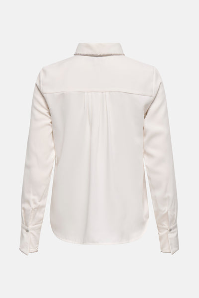 Chemise à manches longues blanche de ONLY, ornée de strass au niveau du col et des poignets.