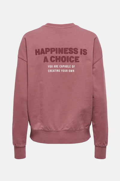 Sweat-shirt rose de ONLY, avec un message imprimé au dos, coupe décontractée et finitions côtelées.