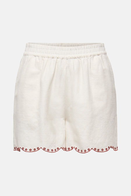 Kort wit topje van JDY met elastische tailleband en rode festonrand.