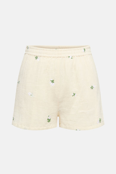 Short beige de JDY avec un motif floral brodé et une taille élastiquée.
