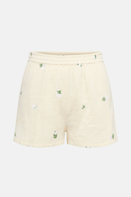 Short beige de JDY avec un motif floral brodé et une taille élastiquée.
