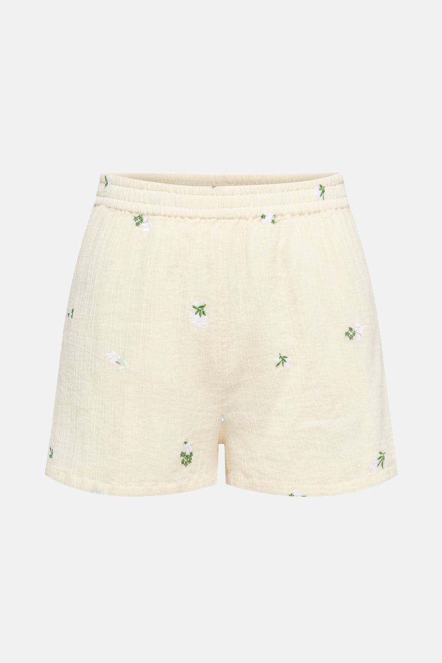 Korte beige JDY met witte en groene bloemrijke broderies, elastische taille.