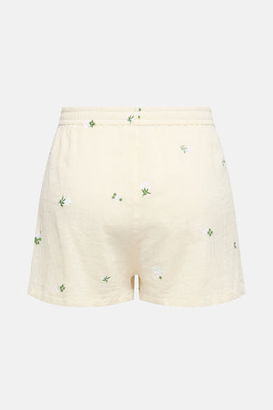 Short beige de JDY avec broderies florales blanches et vertes, taille élastique.