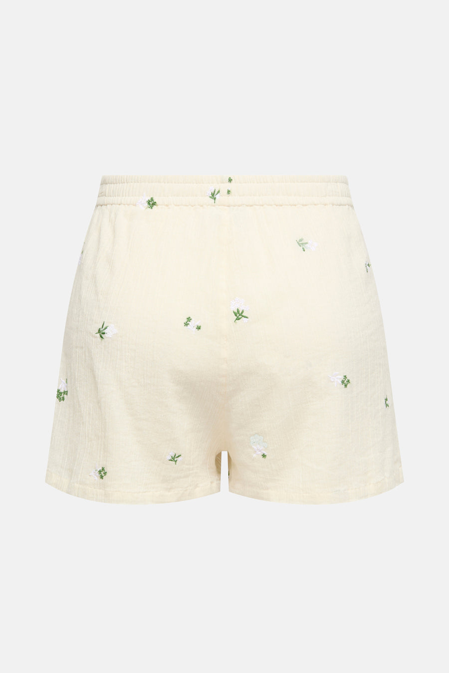 Short beige de JDY avec broderies florales blanches et vertes, taille élastique.